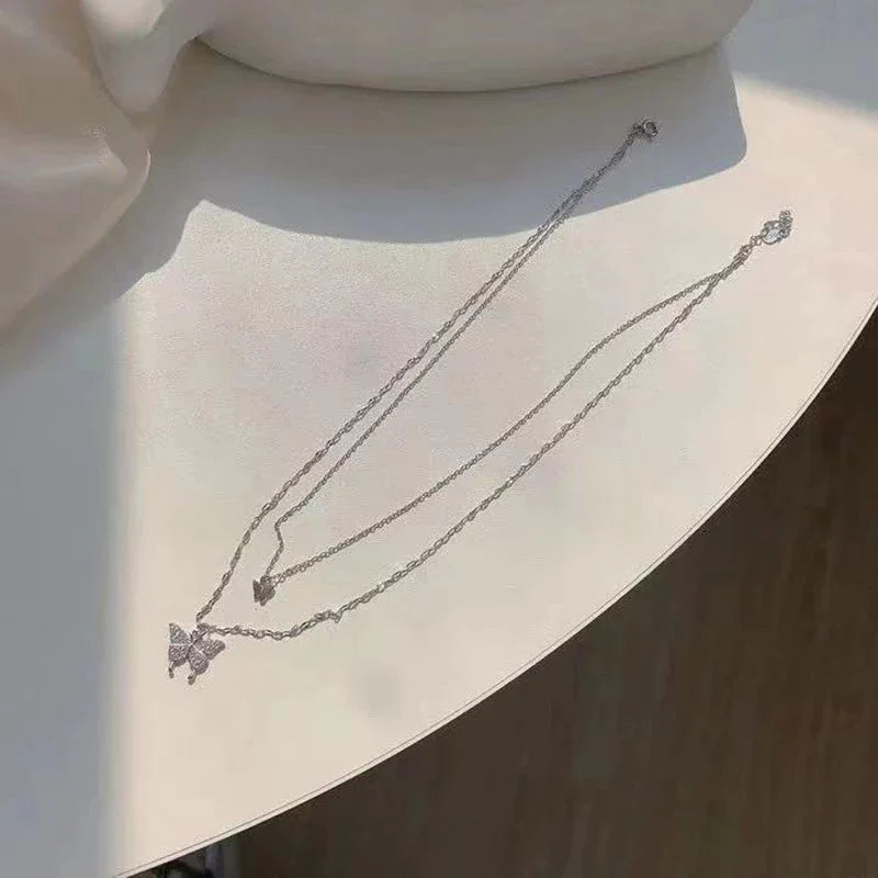 Elegant Silver Necklace Set Featuring a Dazzling Butterfly Design