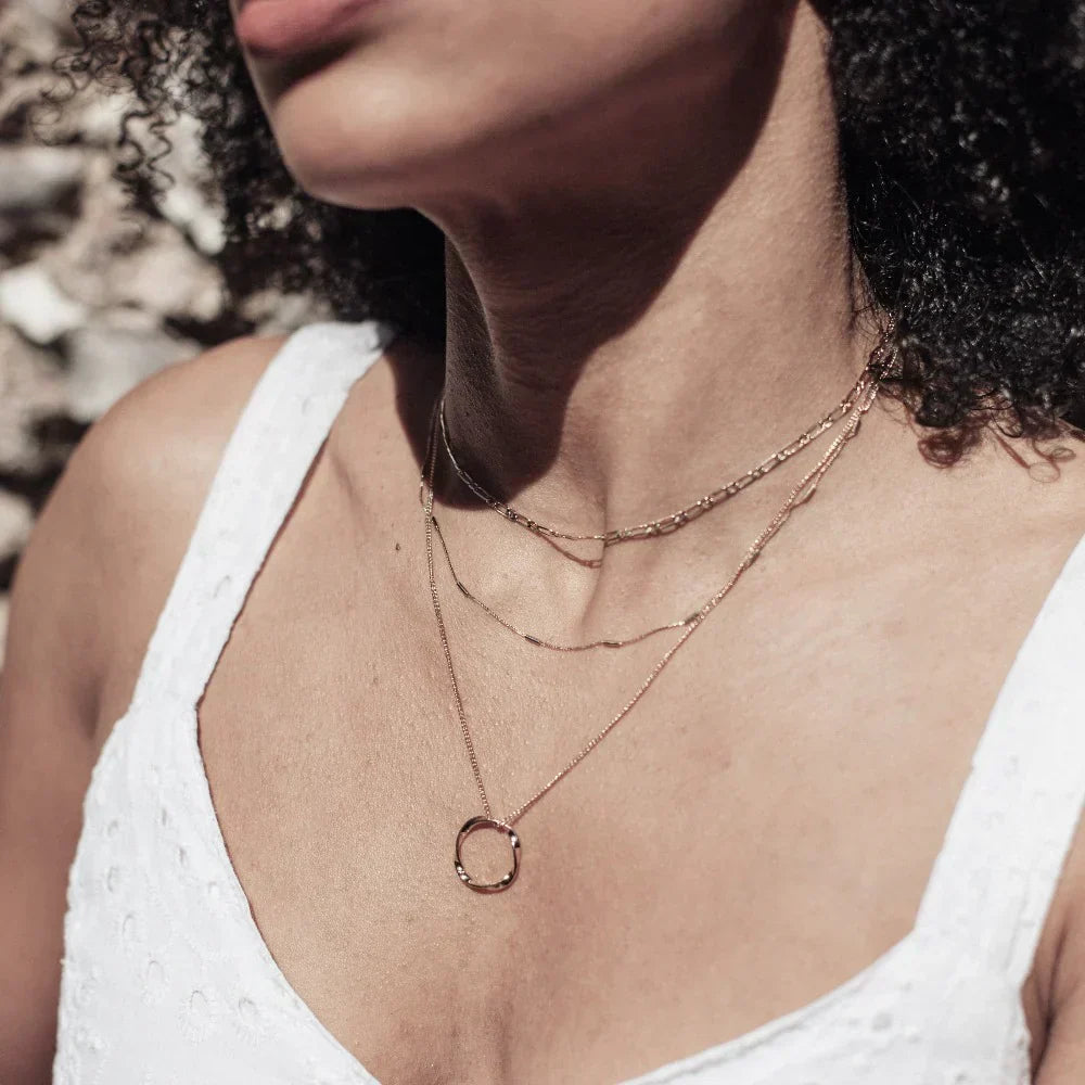 Gold Three-Strand Necklace with Open Circle Design